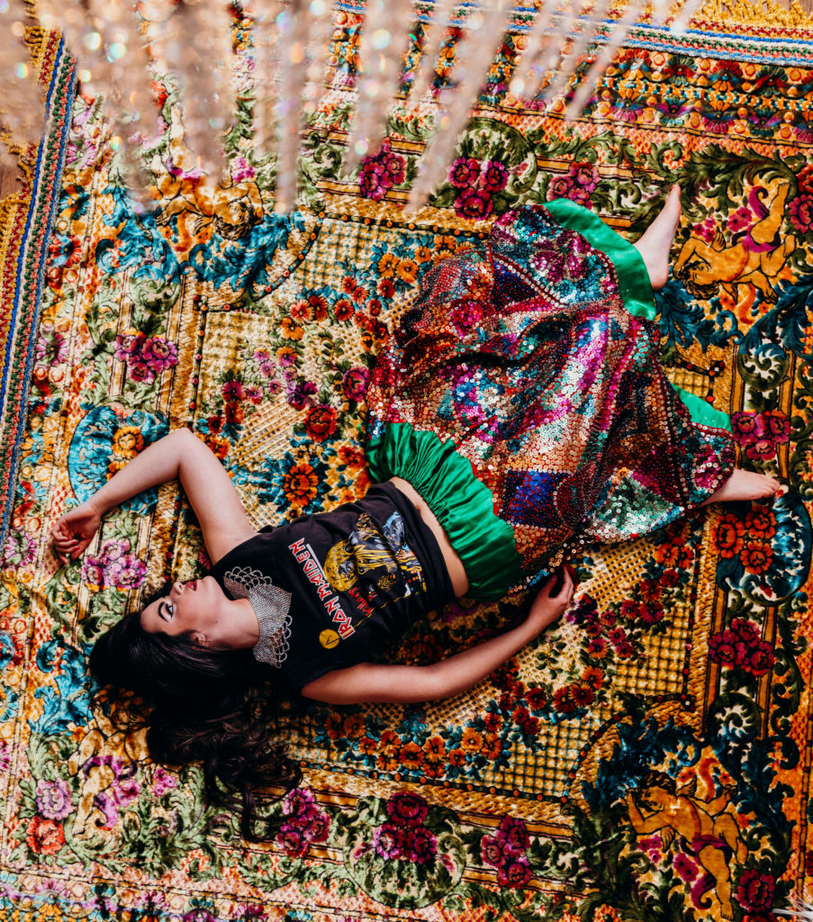 Finally, we have Katie sprawled out over that velvet rug I was talking about in a cut-off 80s Iron Maiden tee and one of our sequinned China Poblana skirts. We added a 60s beaded collar for giggles. 